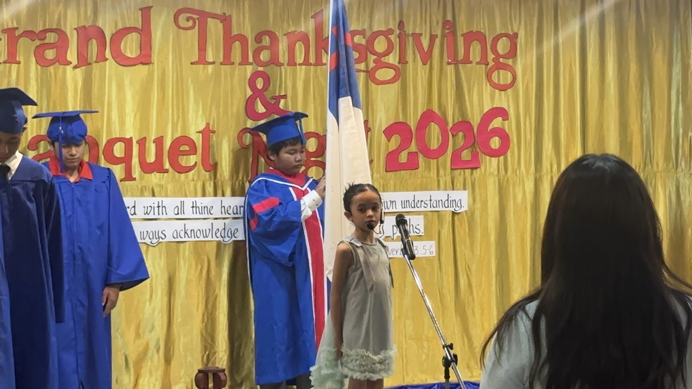 A graduate at the microphone