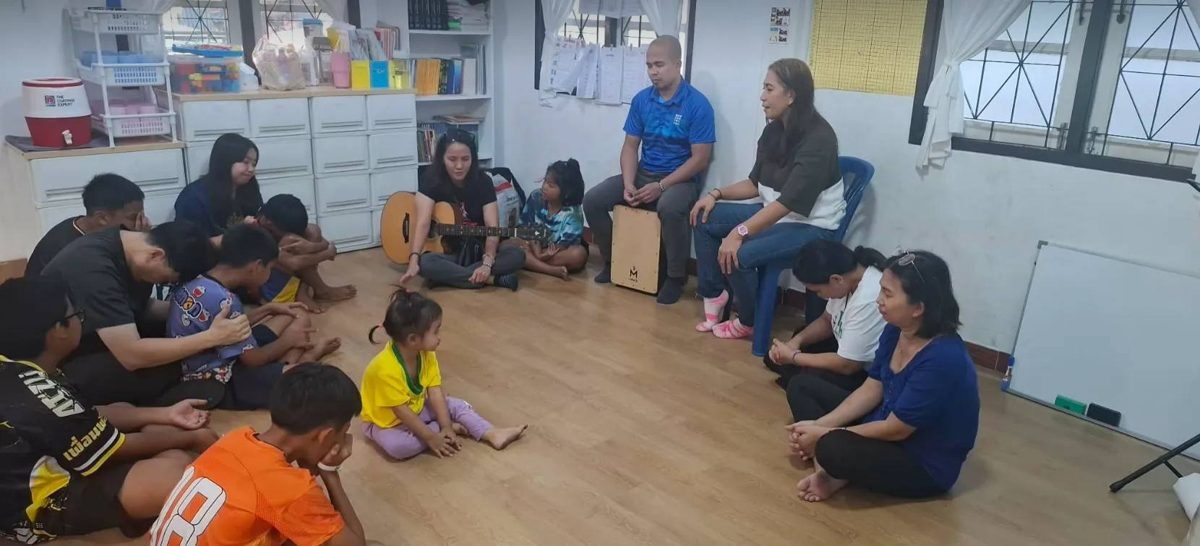 Teachers talking with the children