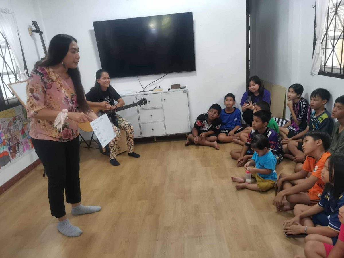 Children and teachers in a classroom at Living Grace