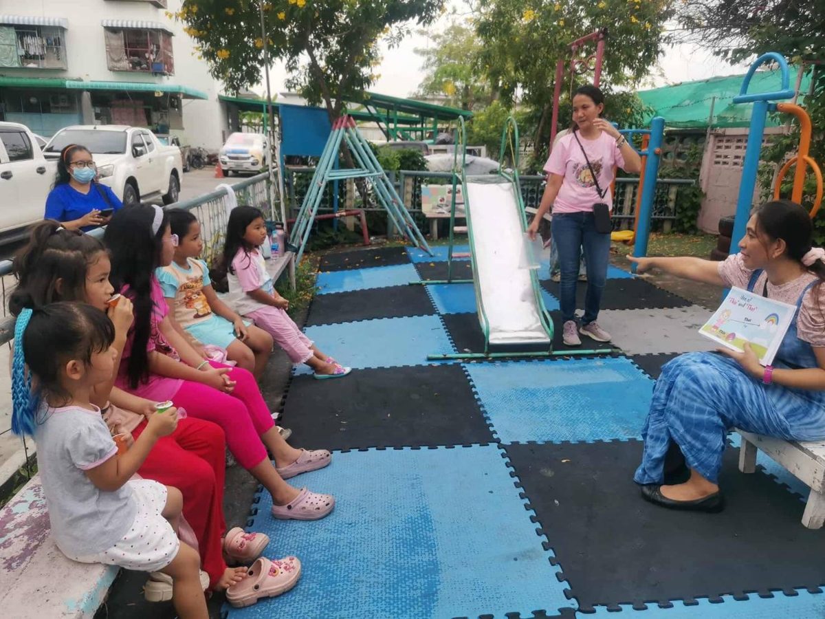 Children and teachers gathered for a lesson